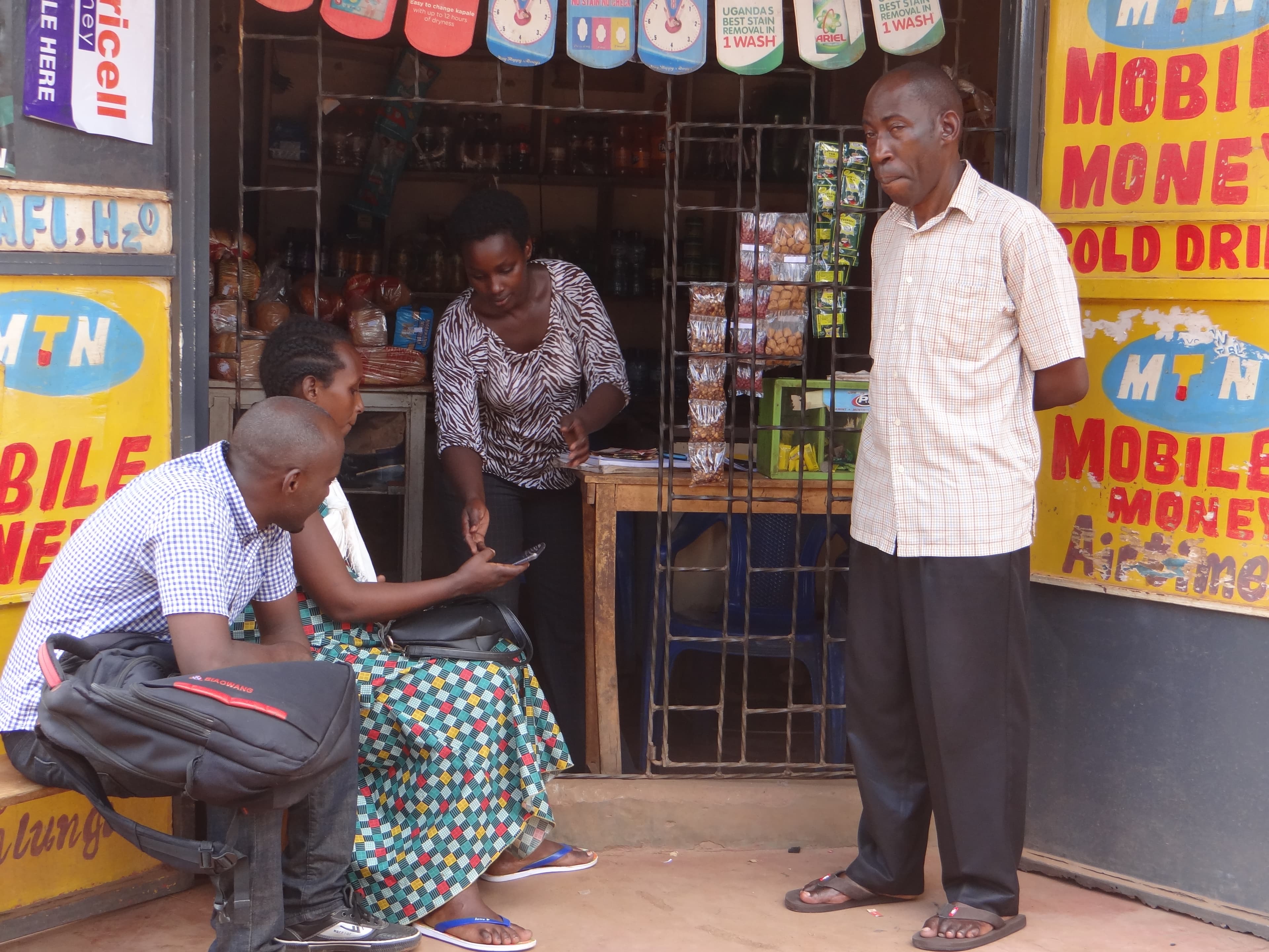 A mobile money outlet in Uganda. Illustrative image of the informal, cash-heavy merchant segment that SoftPOS products like Nearpays' target across Africa.