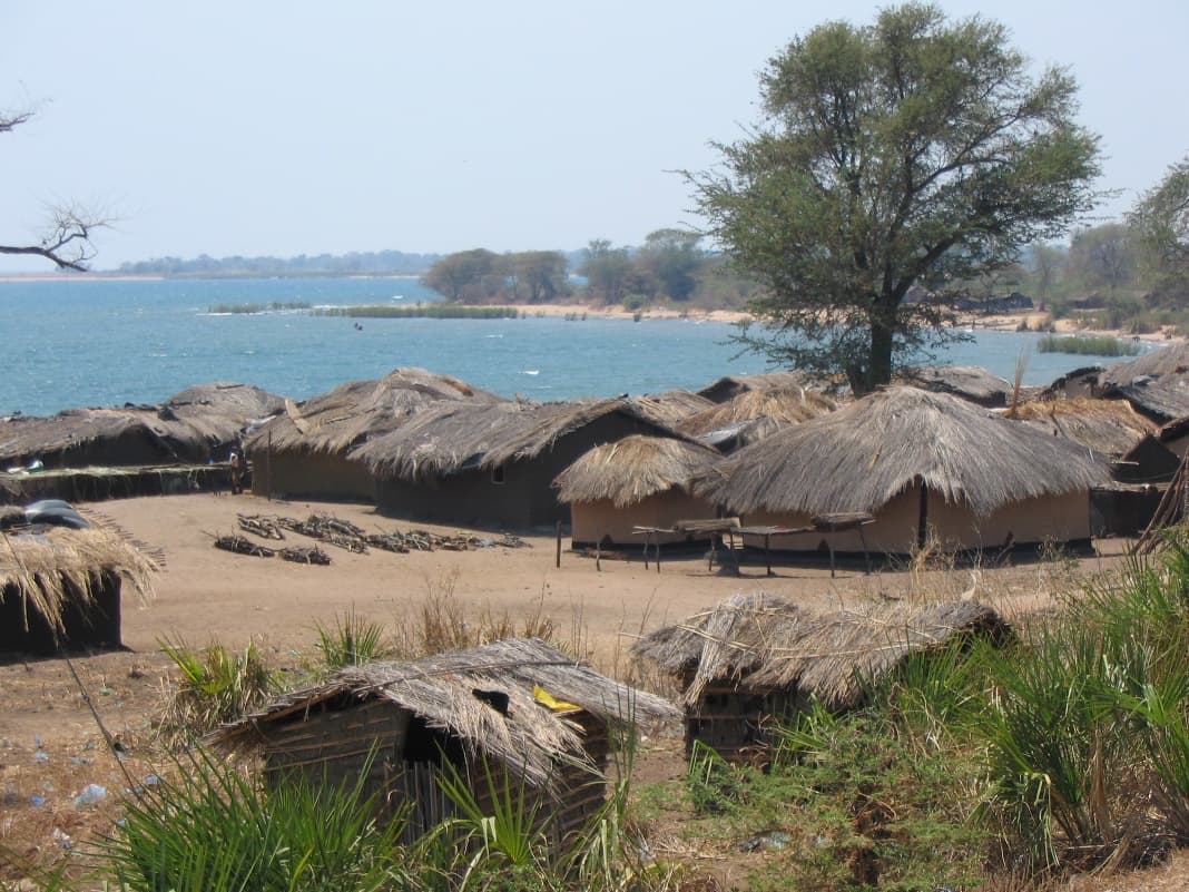 Illustrative: a lakeshore village in Malawi. GSMA's report finds 87% of the country has 4G coverage, but mobile internet use lags far behind.