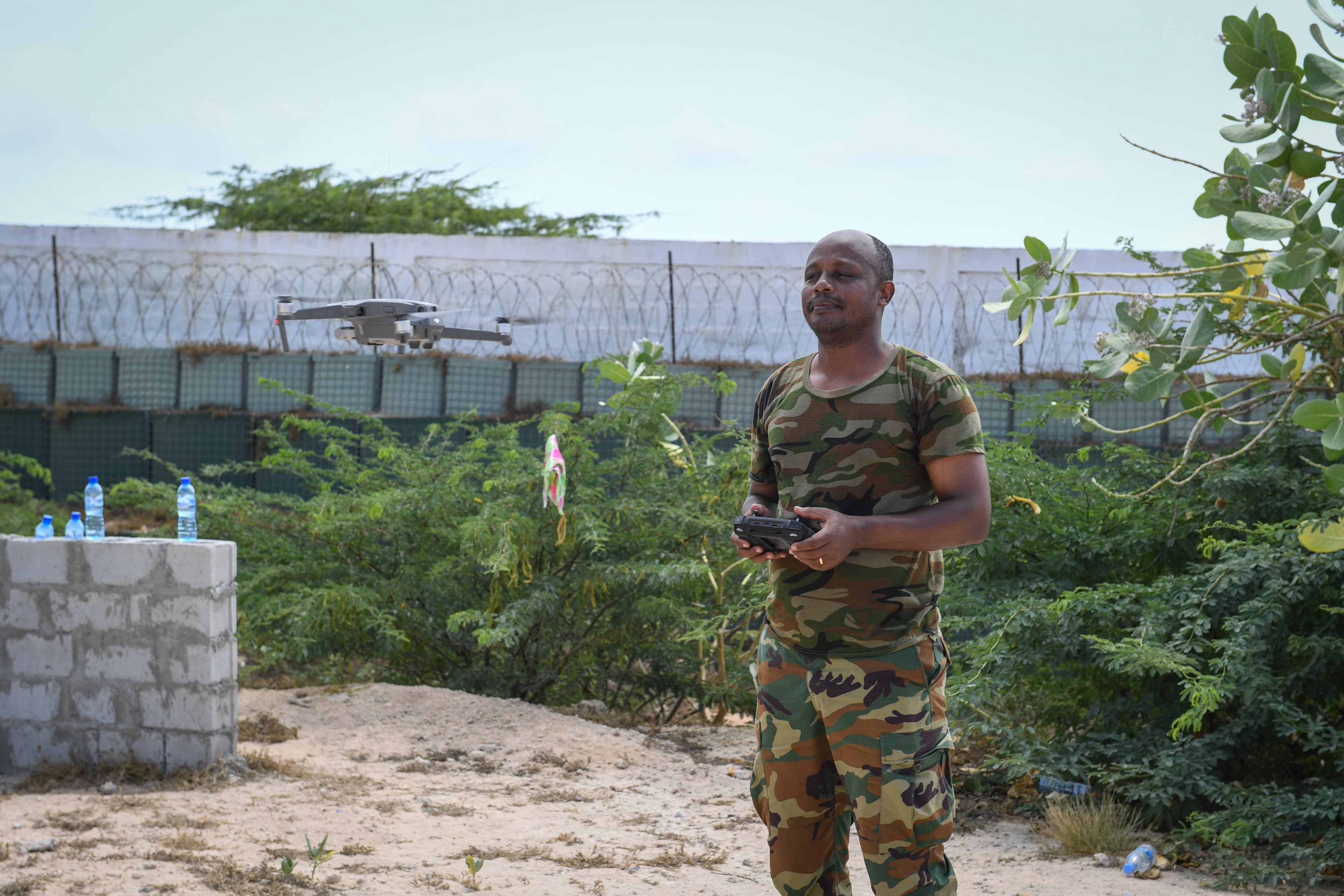An AU peacekeeping officer flies a surveillance drone during a training session in Mogadishu, Somalia, October 2021. Illustrative: not a Terra Industries system, but representative of drone use by African security forces.