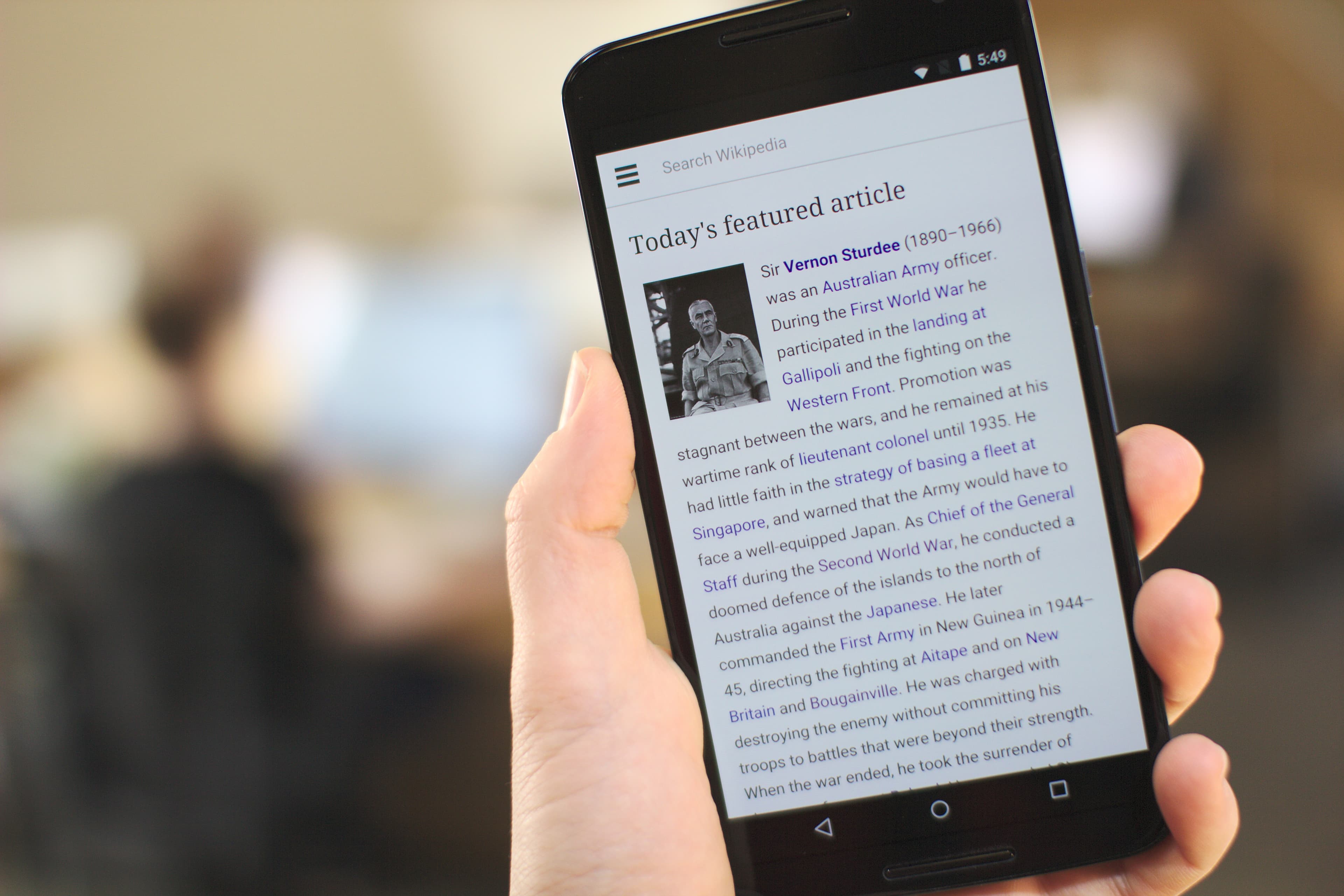 An Android smartphone in hand. Google's Gemini app requires at least 2GB of RAM and Android 9, and does not support Android Go, the lightweight Android version common on budget African handsets. Illustrative image, not a specific device model mentioned in this story.