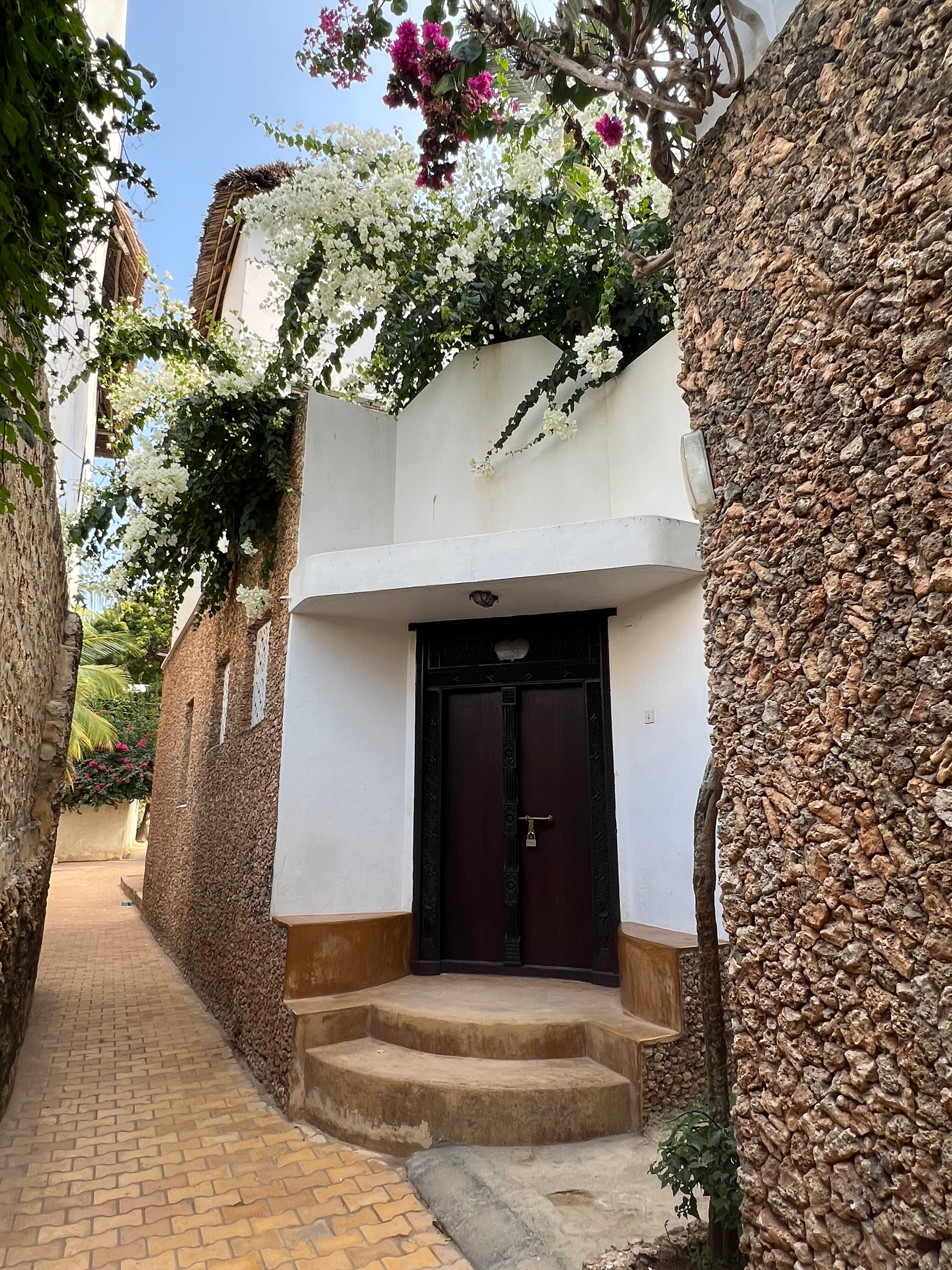 Illustrative: traditional coral-stone architecture in Lamu's UNESCO World Heritage Old Town, on the same coastline where Dangote's planned refinery would be built.