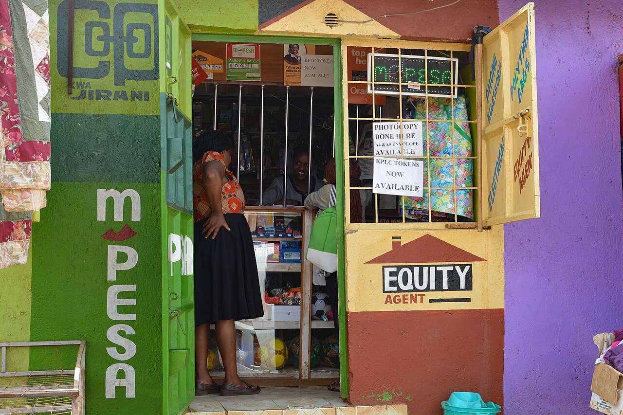 An M-Pesa mobile money agent in Nairobi, Kenya. In the DRC pilot, M-Pesa wallet top-ups are settled with stablecoins in the background. (Illustrative)
